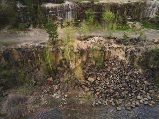 Aerial drone view Basalt columns Amazing industrial landscape, on Emerald lake in a flooded quarry,...