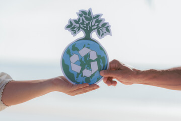 Hands holding environmental protection pictograms, world environment day, environmentally friendliness or eco friendly, ecology, earth day, sustainable living, environmental social governance concept.