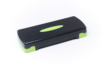 black and green stepped platform. Aerobic stepper on a white background. Aerobic step for fitness...