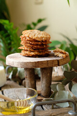 Honey oatmeal chip cookies. Side view. Milk.