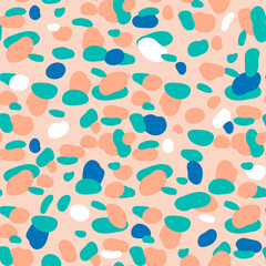 Seamless abstract pattern with irregular circle shapes on peach background. Decorative texture. Vector illustration