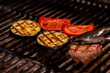 Beef, eggplant and sweet pepper are grilled on a charcoal grill