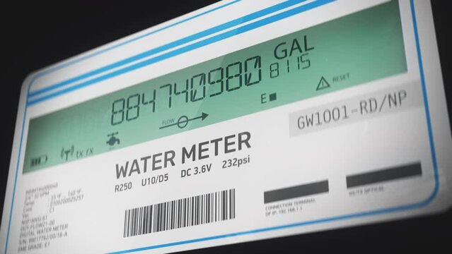 Smart water meter showing volume of gallons used by residence, utility bills. Digital imperial water meter measuring water usage