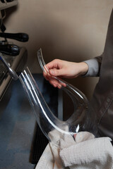 sommelier man wiping dishes decanter for wine.