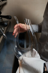 sommelier man wiping dishes decanter for wine.