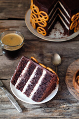 Beer chocolate cake. Pretzels. Guinness. Side view. wooden background.
