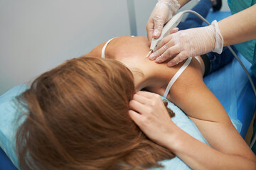 Woman having carboxytherapy procedure in medical center