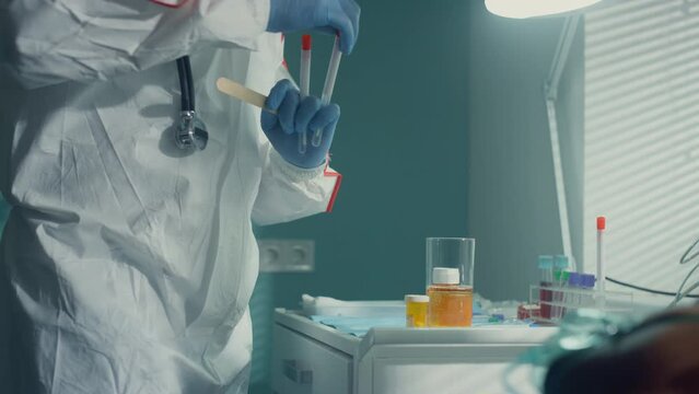 Doctor testing covid19 patient for virus in hospital infectious unit closeup.
