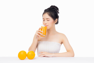 Young Asian woman drinking orange juice and holding glass of orang juice Isolated on white...