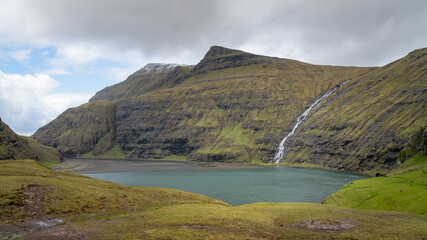 Fototapeta na wymiar Landscape and lake from Village of Saksun located on the island of Streymoy, Faroe Islands, Denmark