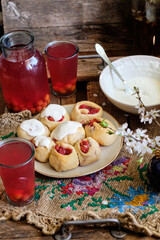 Buns with cherry and cream sauce. cherry compote. side view.