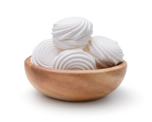 Marshmallows in a wooden bowl isolated.