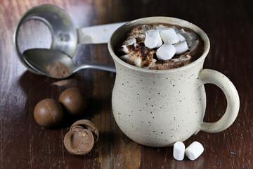 hot chocolate drink in a fictile mug on wooden background