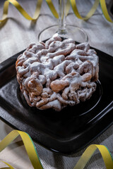 Traditional Finnish cuisine: Funnel cakes with powdered sugar topping are eaten around May 1st with homemade Sima (mead)