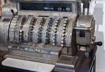 Antique cash register in an old fashion shop