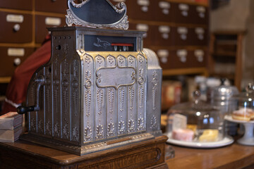 Antique cash register in an old fashion shop