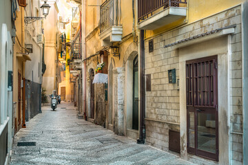 Typical Italian narrow street in old town Bari, depth of field effect, Puglia (Apulia), southern Italy