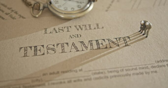 Last will and testament legacy, inheritance or death tax concept : Miniature elder old couple stands on a legal document form, depicts preparing to transfer properties to their heirs after death