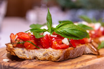 Ciabatta bruschetta with tomatoes, mozzarella and basil