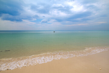 Fototapeta na wymiar Empty exotic tropical beach with beautiful clouds. Relaxing sea view