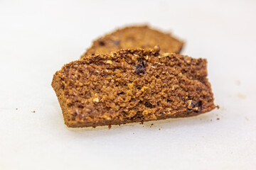 A slice of rye bread with seeds and raisins - sweet bread