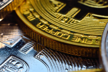 Gold and silver bitcoin coins.