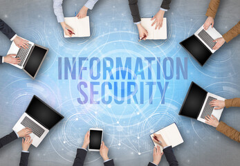 Group of people in front of a laptop, security concept