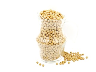 Close-up of soybean seeds in a clear glass jar isolated on white background