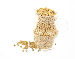 Close-up of soybean seeds in a clear glass jar isolated on white background
