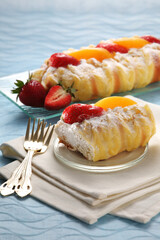Cream puffs with strawberry and peach