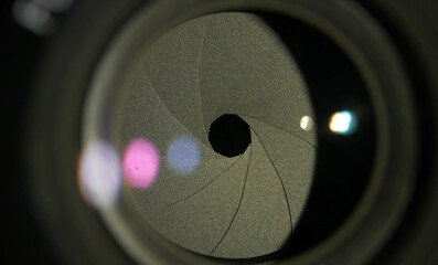 Macro close up shot of diaphragm of camera equipment. Opticel lens, focus device. Focal aperture concept, cinema, photography or videography concept. Iris of camera.