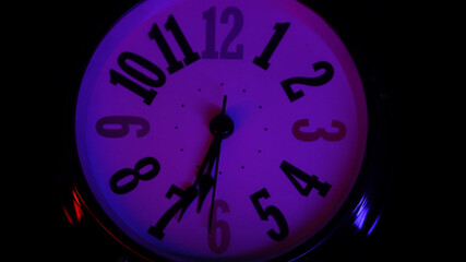 Time, second, hour concept. Retro look old clock, timer is rotating on neon light. Macro shot,...