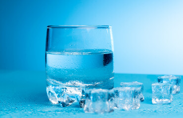 Glass of water with ice cubes