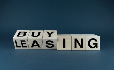 Leasing vs buy. Cubes form the choice words leasing or buying. - obrazy, fototapety, plakaty