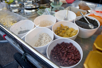 Hot fresh homemade soy milk selling by street vendors in Thailand. Usually can add boiled red beans, tapioca, boiled job’s tears, basil seeds, various transparent jellies.