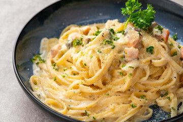 homemade fettuccine pasta with white cream sauce. fettuccine Carbonara made with eggs, hard cheese,...