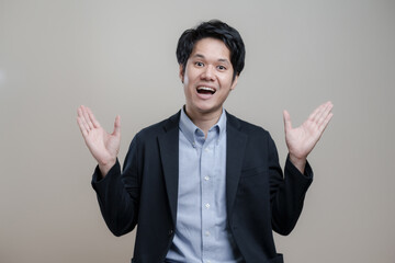 Surprised asian business man and excited surprised guy receive awesome news, saying wow concept, free for copy blank space