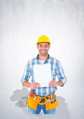 Portrait of caucasian male worker holding a clipboard against copy space on grey background