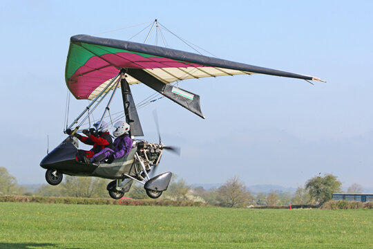 	
Ultralight airplane taking off from a farm strip	