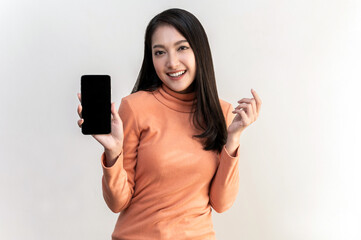 Portrait photo of young beautiful Asian woman feeling happy or surprise shock and holding smart phone with black empty screen on white background can use for advertising or product presenting concept.