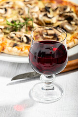 closeup of mushroom pizza with rosemary