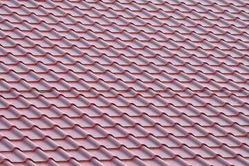 The roof of the house is covered with metal tiles
