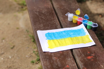 Children's drawings against the war in Ukraine. A call for peace, a drawing of the Ukrainian flag...