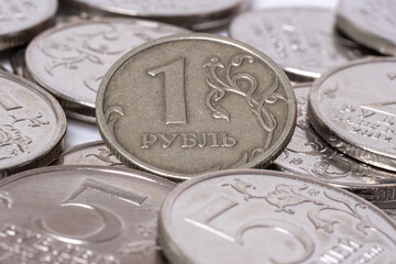 Background of coins of Russian rubles in denominations of 1 ruble, 2 rubles, 5 rubles. The ruble is the national currency of Russia. Money concept.