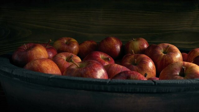 Man Picks Up Apple From Barrel