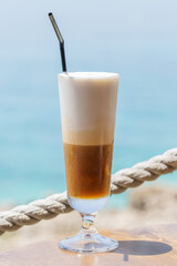 Morning coffee latte by the sea