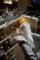 sommelier man wiping dishes decanter for wine.