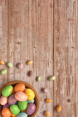 Colorful Easter eggs on a wooden table. Copy space. Top view. Easter holiday concept.  Easter composition, postcard.  