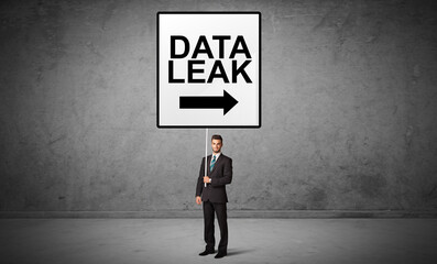 Obraz premium business person holding a traffic sign