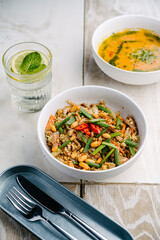 Asian rice noodles with chicken and mushrooms and pumpkin soup